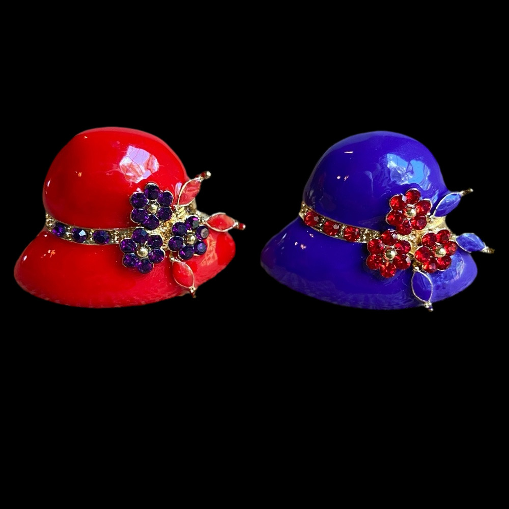 Pair of red and purple hat rings with rhinestone flowers in adjustable goldtone